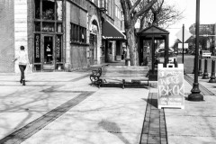 Person walking in after putting a sign