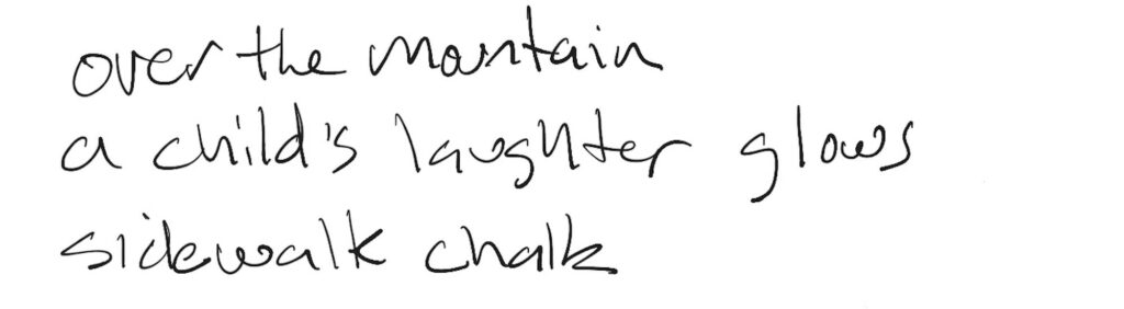 Haiku; over the mountain / a child’s laughter glows / sidewalk chalk