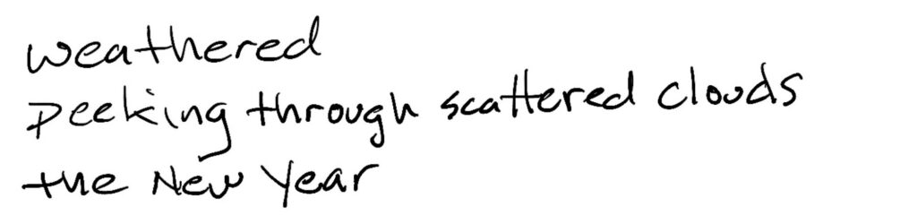 Weathered/peeking through scattered clouds/the New Year