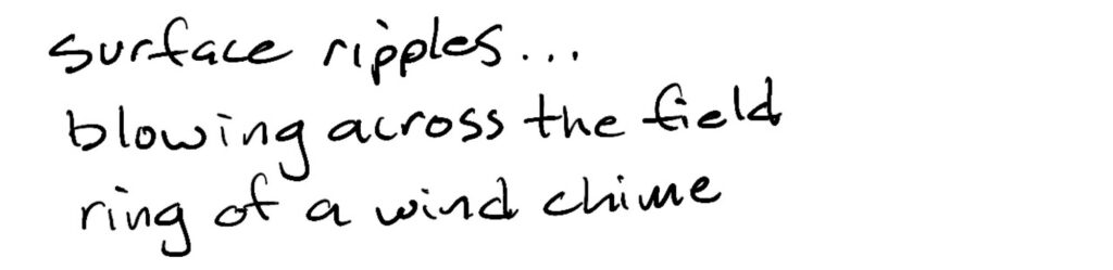 Surface ripples…/blowing across the field/ring of a wind chime